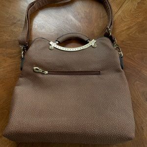 Women’s textured vinyl handbag with detachable shoulder strap and cloth lining